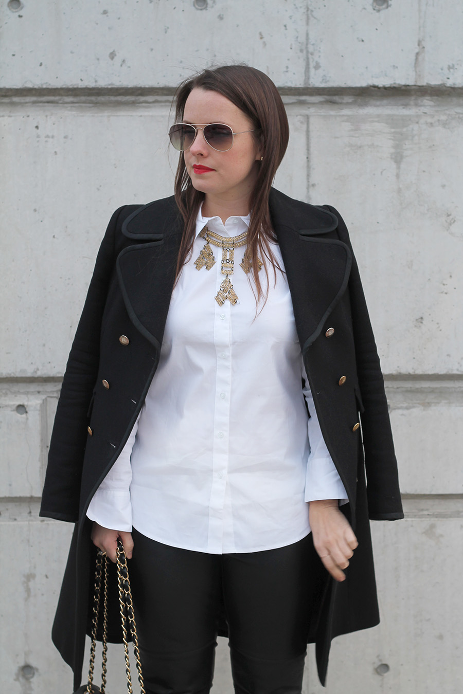 White Button Up Shirt, Black Wool Coat, Brass Necklace, Aviator Sunglasses, Bright Lipstick
