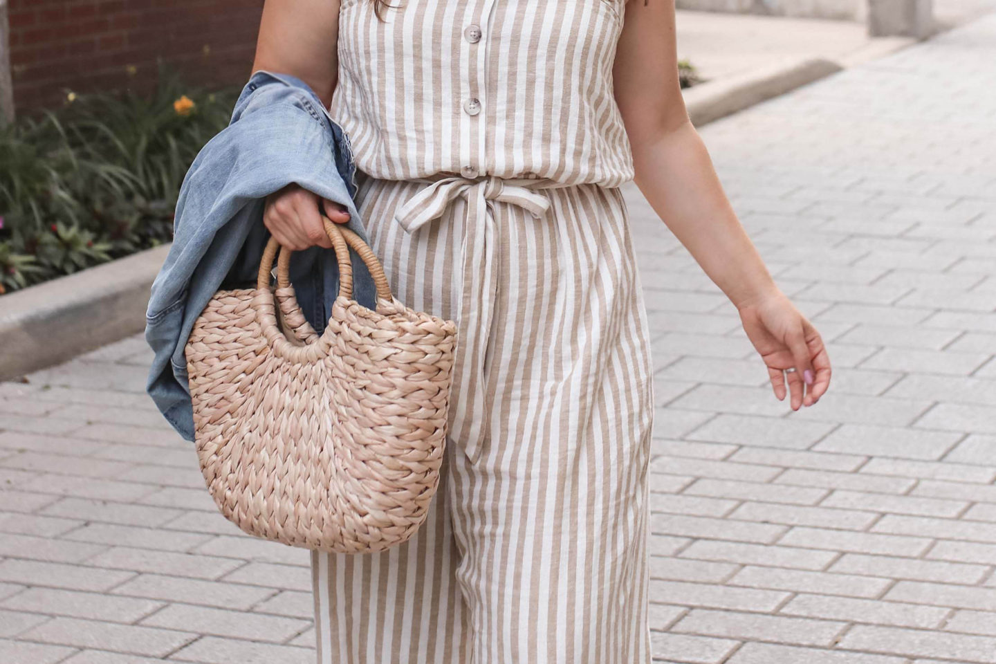 outfit ideas with linen jumpsuit with straw bag and denim jacket